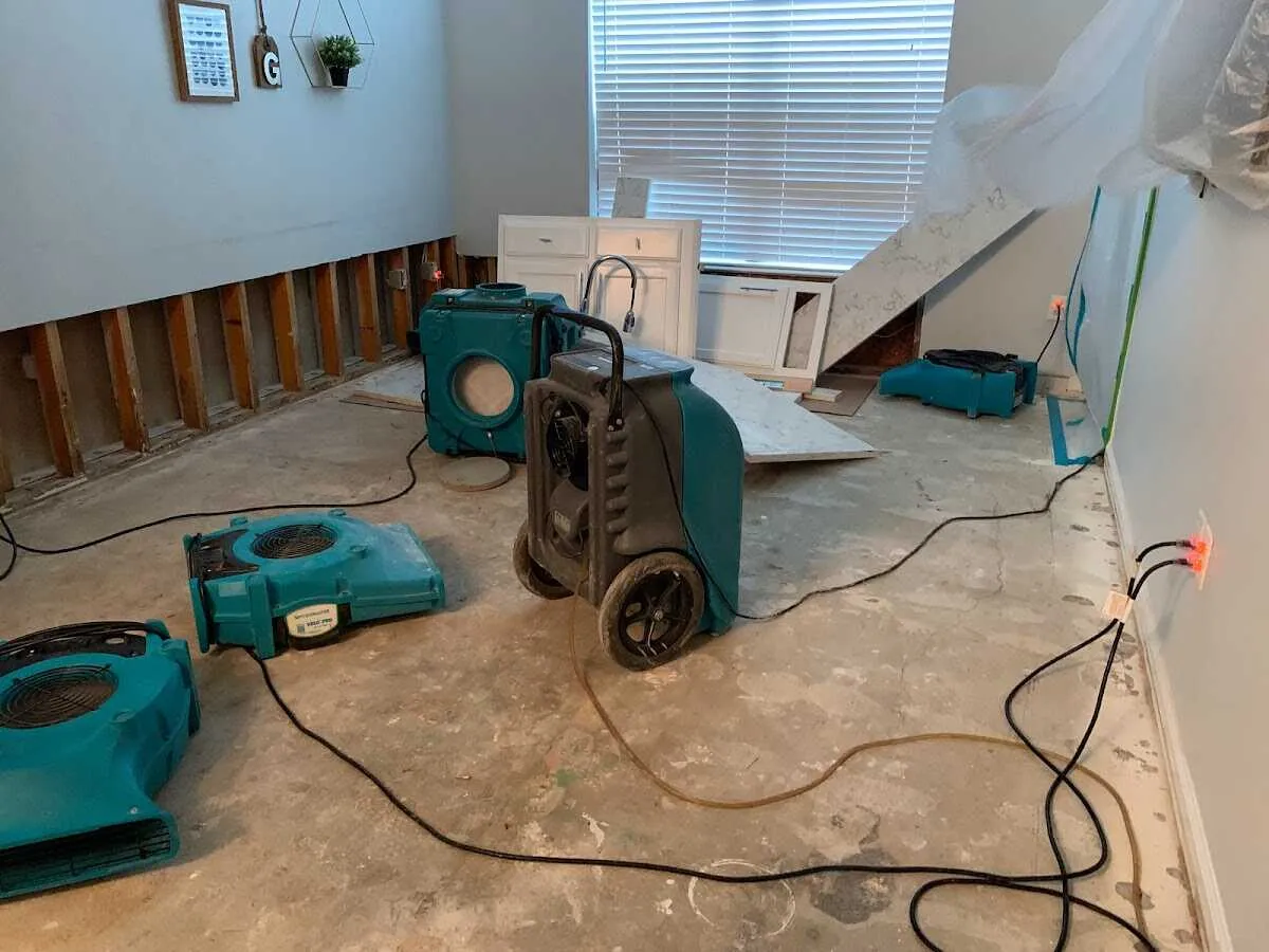 Dehumidifier in flood-cut room for Water Damage Restoration in Atlas