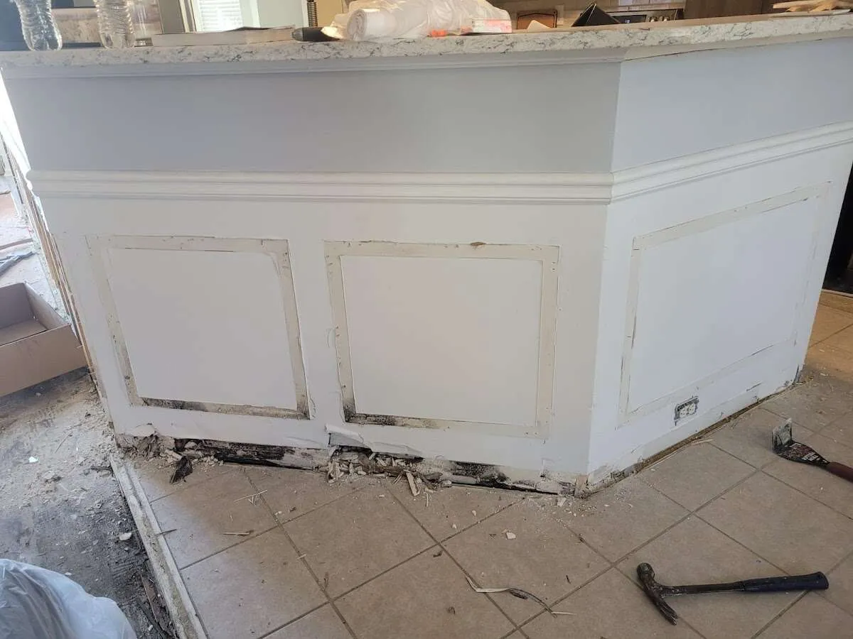 Water damage and mold on kitchen during Storm Damage Restoration in Atlas
